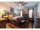 Spacious bedroom featuring warm natural light, ceiling fan, and stylish decor accents at 397 Woodgate Way, Summerville, SC 29485
