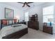 Stylish bedroom with a bed, dark wood dresser, and decorative accents at 397 Woodgate Way, Summerville, SC 29485