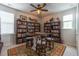 Inviting bonus room with bookshelves, chess table, and unique ceiling fan at 397 Woodgate Way, Summerville, SC 29485