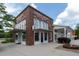 Corner House Cafe and Information Center with brick facade, awning-covered windows, and landscaped surroundings at 397 Woodgate Way, Summerville, SC 29485