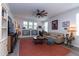Inviting living room with a ceiling fan, neutral sofa, and built-in shelving at 397 Woodgate Way, Summerville, SC 29485