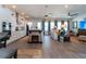 Open-concept living space with a cozy fireplace, modern lighting, and ample natural light at 397 Woodgate Way, Summerville, SC 29485