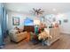 Comfortable living room featuring stylish sofas, a large TV, and bright windows with soft curtains at 397 Woodgate Way, Summerville, SC 29485