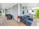 Spacious wrap-around porch with comfortable seating and lush greenery creating a relaxing outdoor space at 397 Woodgate Way, Summerville, SC 29485