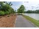 Scenic walking path alongside the lake, perfect for a morning jog or evening stroll at 397 Woodgate Way, Summerville, SC 29485