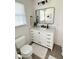 Bathroom featuring a white vanity with marble countertop and black fixtures at 404 Rose Ln, Summerville, SC 29485