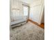 Bedroom featuring white crib, hardwood floors and stylish area rug at 404 Rose Ln, Summerville, SC 29485