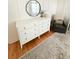 Bedroom featuring stylish white dresser with round mirror at 404 Rose Ln, Summerville, SC 29485