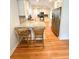Bright, eat-in kitchen with granite countertops, stainless appliances, and white cabinets at 404 Rose Ln, Summerville, SC 29485