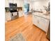 Bright kitchen features an island, stainless steel appliances, white cabinets, and sliding glass doors at 404 Rose Ln, Summerville, SC 29485