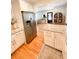 Modern kitchen featuring stainless steel refrigerator, granite countertops, and wood floors at 404 Rose Ln, Summerville, SC 29485