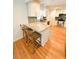 Eat in kitchen features an island, stainless steel appliances, and white cabinets at 404 Rose Ln, Summerville, SC 29485