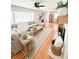 Bright living room with hardwood floors, a sectional sofa, and a decorative fireplace at 404 Rose Ln, Summerville, SC 29485