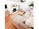 Bright living room features hardwood floors, a ceiling fan, and cozy furniture arrangement at 404 Rose Ln, Summerville, SC 29485