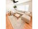 Spacious living room with a comfortable sectional sofa, natural lighting and wood floors at 404 Rose Ln, Summerville, SC 29485