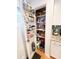 Organized pantry with shelving and door racks, offering ample storage space at 404 Rose Ln, Summerville, SC 29485