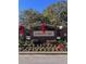 Carolina Bay neighborhood entrance with brick sign, landscaping, and holiday decorations at 4151 Collins Dr, Charleston, SC 29414