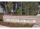 Carolina Bay Park sign made of brick with landscaping and bench in the background at 4151 Collins Dr, Charleston, SC 29414