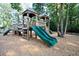 Community playground with wooden play structure, slides, and climbing features at 4151 Collins Dr, Charleston, SC 29414