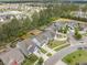 Beautiful aerial view showcasing a neighborhood with well-manicured lawns, mature trees, and access to a serene lake at 419 Whispering Breeze Ln, Summerville, SC 29486