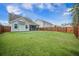 Expansive backyard with lush green grass and tall trees, creating a serene and private outdoor setting at 419 Whispering Breeze Ln, Summerville, SC 29486