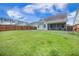 Well-kept backyard featuring a lush lawn, and a wooden fence, providing ample space for recreation at 419 Whispering Breeze Ln, Summerville, SC 29486