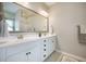 Bathroom vanity with double sinks, a large mirror, and modern fixtures provides ample space at 419 Whispering Breeze Ln, Summerville, SC 29486