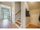 An open foyer with hardwood floors and natural light provides a welcoming entrance at 419 Whispering Breeze Ln, Summerville, SC 29486