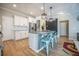 Kitchen features a large island with seating, stainless steel appliances, and an open layout at 419 Whispering Breeze Ln, Summerville, SC 29486