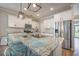Kitchen island with granite countertop, stainless steel appliances, and subway tile backsplash at 419 Whispering Breeze Ln, Summerville, SC 29486