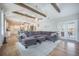 Bright open floor plan living room with vaulted ceilings, exposed beams, and lots of natural light at 419 Whispering Breeze Ln, Summerville, SC 29486
