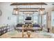 Bright open concept living area with modern fixtures, a fireplace, lots of seating and bright natural light at 419 Whispering Breeze Ln, Summerville, SC 29486