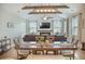 Open-concept living area featuring modern decor, fireplace, spacious seating, and bright natural light at 419 Whispering Breeze Ln, Summerville, SC 29486