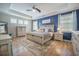 Inviting main bedroom features a tray ceiling, a large bed, and lots of bright, natural light at 419 Whispering Breeze Ln, Summerville, SC 29486