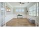 Cozy office space with hardwood floors, white wainscoting, and ample natural light at 419 Whispering Breeze Ln, Summerville, SC 29486