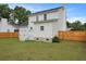Well-maintained backyard showcasing the home's back exterior and new wooden fencing at 4301 Trevor St, North Charleston, SC 29420
