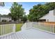 Open backyard featuring a large deck and lush greenery, perfect for outdoor gatherings at 4301 Trevor St, North Charleston, SC 29420
