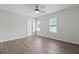 Spacious bedroom featuring updated floors, ceiling fan, and windows for natural light at 4301 Trevor St, North Charleston, SC 29420