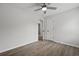 Bright bedroom featuring a ceiling fan and updated floors, with a view to an ensuite at 4301 Trevor St, North Charleston, SC 29420
