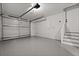Spacious garage with epoxy flooring and access to a pedestrian door at 4301 Trevor St, North Charleston, SC 29420