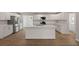 Spacious kitchen with an island featuring stainless appliances and white cabinetry at 4301 Trevor St, North Charleston, SC 29420