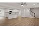 Open-concept design with wood floors and a modern kitchen featuring white cabinetry and stainless steel appliances at 4301 Trevor St, North Charleston, SC 29420