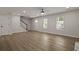 Spacious living room featuring a staircase, front door and two windows offering ample natural light at 4301 Trevor St, North Charleston, SC 29420