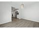 Bright room with view of the kitchen and stainless steel refrigerator at 4301 Trevor St, North Charleston, SC 29420