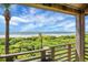 Picturesque view of the beach from a private wooden balcony framed by native vegetation, sand, and an ocean skyline at 4319 Sea Forest Dr, Kiawah Island, SC 29455