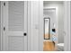 Tastefully designed bathroom with a minimalist black mirror and bright white cabinetry, featuring modern fixtures and finishes at 4319 Sea Forest Dr, Kiawah Island, SC 29455