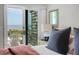 Well-lit bedroom boasts ocean views from a sliding glass door leading to the outside patio at 4319 Sea Forest Dr, Kiawah Island, SC 29455