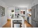 Bright kitchen features an island, stainless steel appliances, and modern white cabinets at 4319 Sea Forest Dr, Kiawah Island, SC 29455