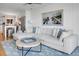 Comfortable living room with a large sectional, stylish rug, and an open layout to the kitchen at 4319 Sea Forest Dr, Kiawah Island, SC 29455