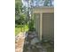 Outside view of the house's back exterior with siding, decking, and wood surroundings at 436 W Butternut Rd, Summerville, SC 29483